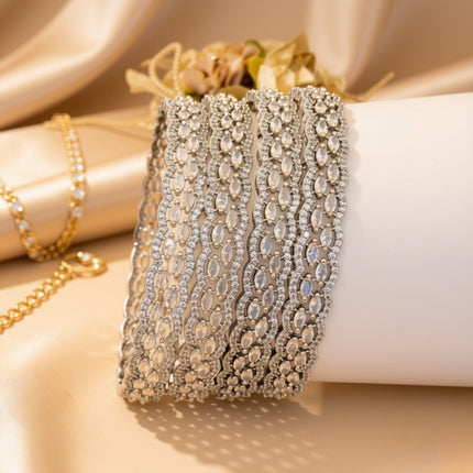 Set of 6 silver-tone wave bangles with blue oval zircon stones – copper/brass fashion jewelry