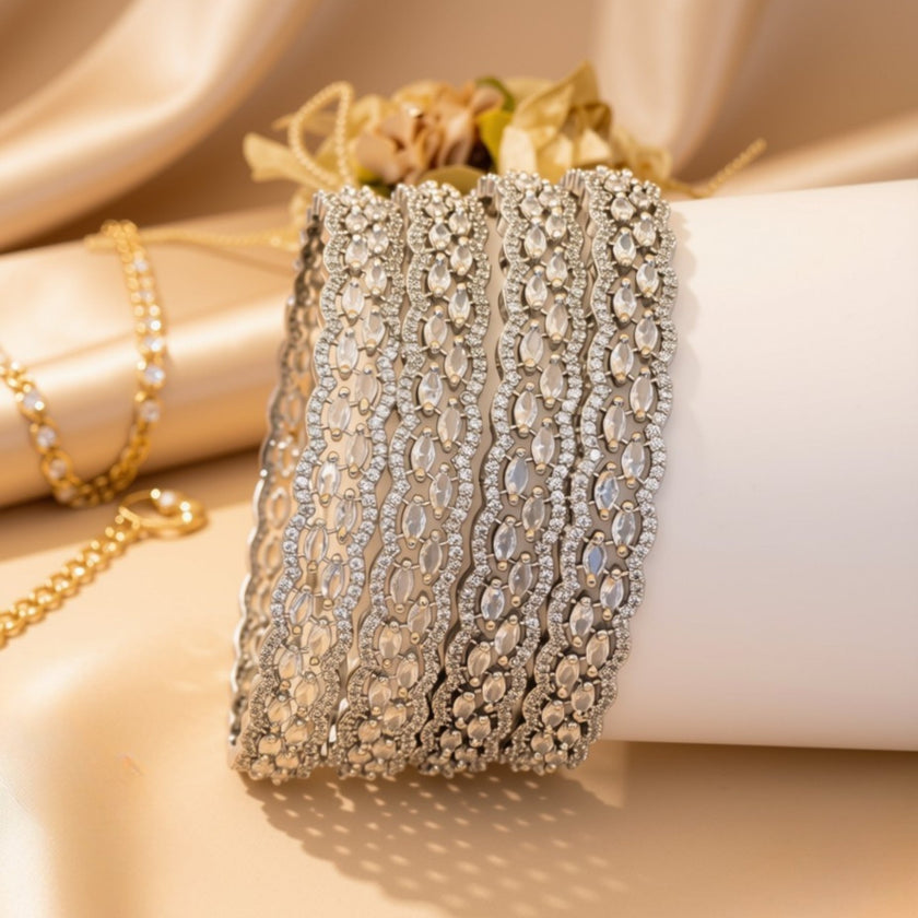 Set of 6 silver-tone wave bangles with blue oval zircon stones – copper/brass fashion jewelry