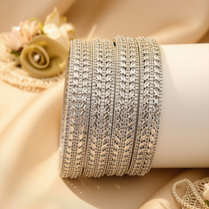 Set of 4 slim gold-tone baguette zircon bangles – copper/brass fashion jewelry
