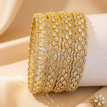 Set of 4 silver-tone wave bangles with marquise pink zircon stones – copper/brass fashion jewelry