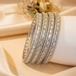 Set of 4 silver-tone wave bangles with marquise navy blue zircon stones – copper/brass fashion jewelry