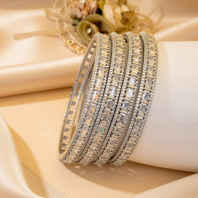 Set of 4 silver-tone wave bangles with marquise navy blue zircon stones – copper/brass fashion jewelry