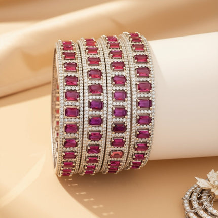 Set of 6 gold-tone slim bangles with emerald-cut blue zircon stones – copper/brass fashion jewelry