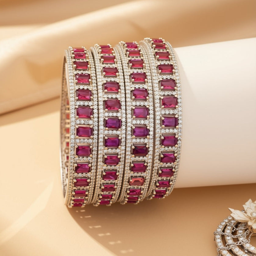 Set of 6 gold-tone slim bangles with emerald-cut blue zircon stones – copper/brass fashion jewelry