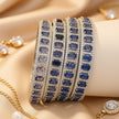 Bangle set with emerald-cut colored zircon stones – copper/brass fashion jewelry