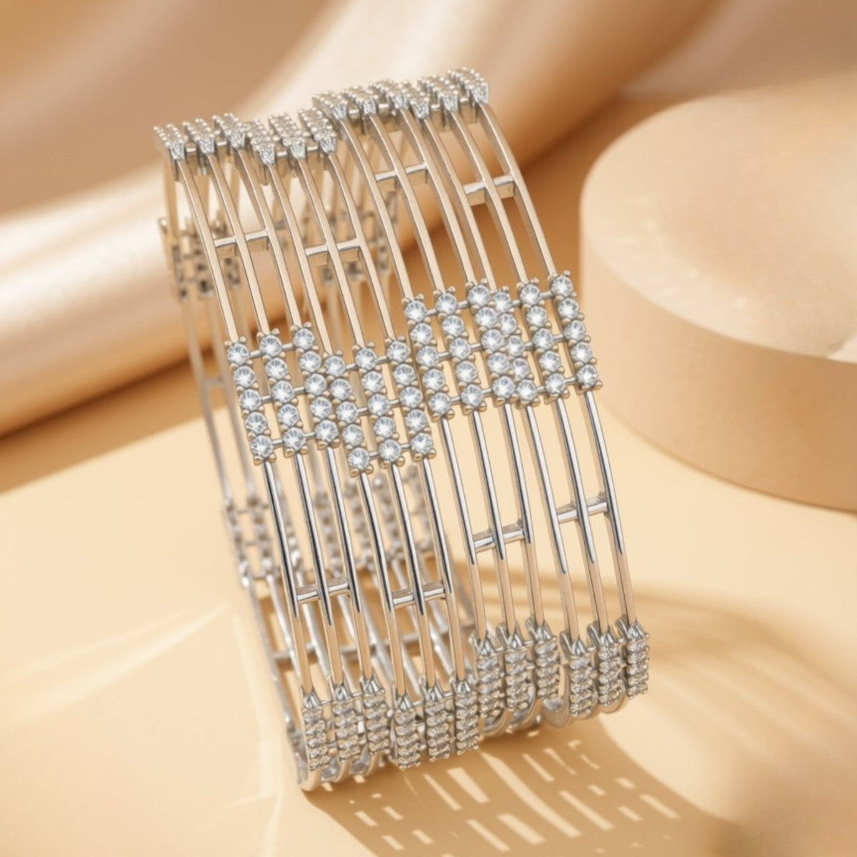 Set of 4 silver-tone openwork bangles with clear marquise zircon floral motifs – copper/brass fashion jewelry