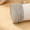 Gold-tone ornate bangles with colored zircon stones – copper/brass fashion jewelry