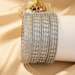 Set of 4 gold-tone bangles with ruby and emerald green checkerboard square zircon pattern – copper/brass fashion jewelry