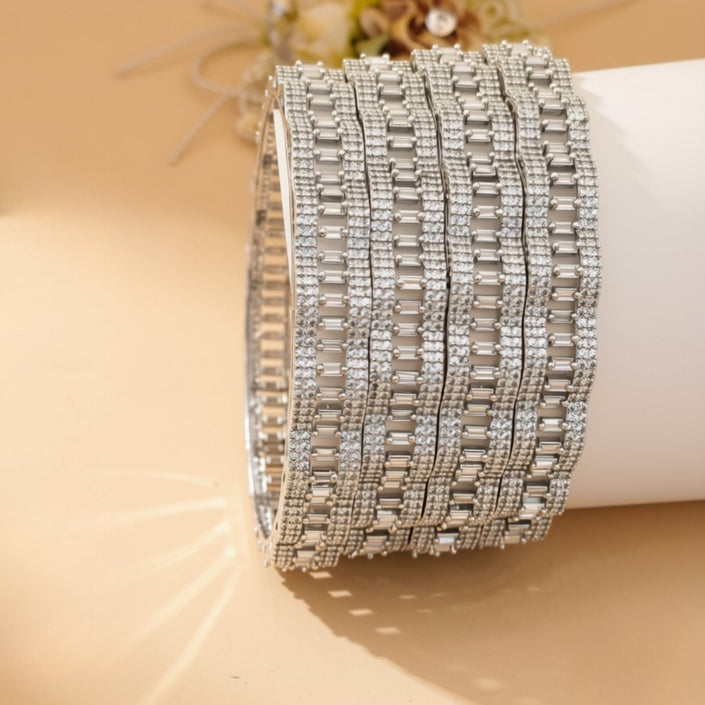 Set of 4 silver-tone bangles with emerald green flower clusters on clear pavé zircon background – copper/brass fashion jewelry